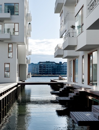 Havneholmen mixed-use development in Copenhagen contains 236 apartments and consists of two U-shaped blocks with with inner courtyards.