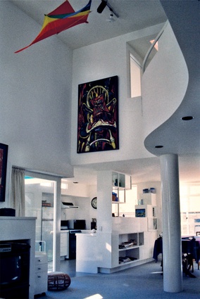 A Philip Clairmont painting hangs above the living area.