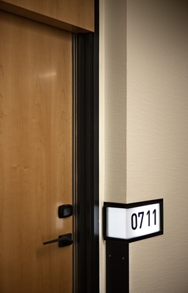 Typical room entrance with back-lit number.