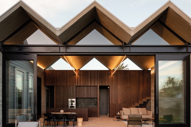 The ‘pleated’ concrete roof, poured in situ, appears to float above the large living room.