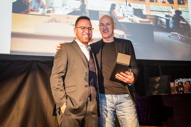 Dave Strachan of Strachan Group Architects accepting the Workplace up to 1,000sqm award from host Federico Monsalve at the 2017 Interior Awards evening.