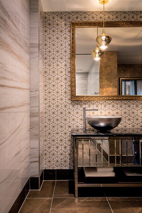 The ensuites in each of the four luxury suites are different. Tiles and mirror frames with traditional patterning offer a twist when paired with the slickness of metallics.