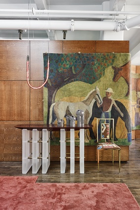 A large pastoral painting by Albert Emiel is beautifully juxtaposed against the apartment‘s many decadent furnishings.