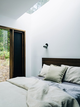 In the bedrooms, privacy and ventilation are managed with roof windows and shutters.