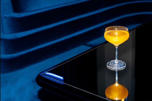 The mirrored table-tops and lighting effect on a cocktail. 