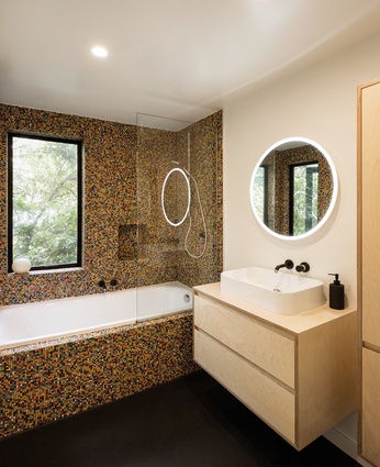 Artedomus mosaic tiles feature in both the  family and en suite bathrooms.
