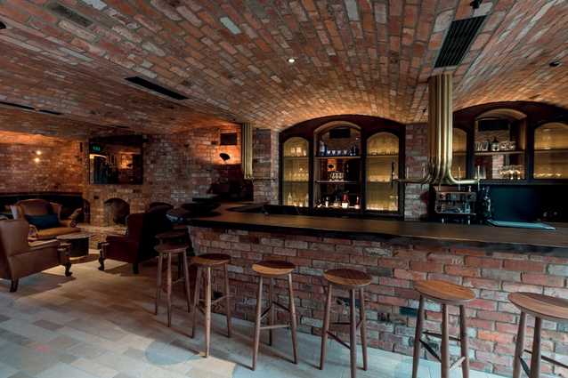 The Alibi bar has a vaulted brick ceiling and a speakeasy feel.