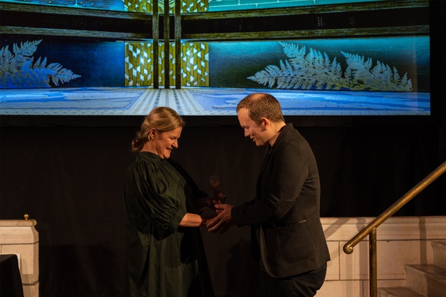 Ari Stevens from Athfield Architects receives the Supreme Award for Te Rau Karamu Marae from convenor Amanda Harkness.