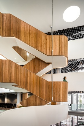The sculptural, timber staircases start on the upper levels.