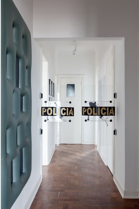 The police barricade intervention to the hallway is Swinging Doors by conceptual Turkish artist – Ahmet Ogut