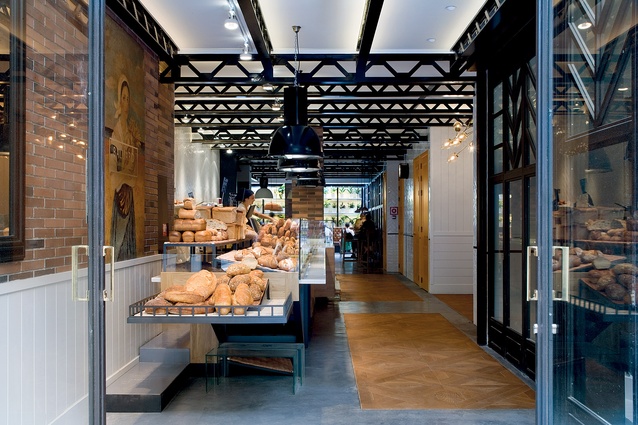 The reception doubles as bread counter luring passerbyers and enhancing security for the lobby area. 