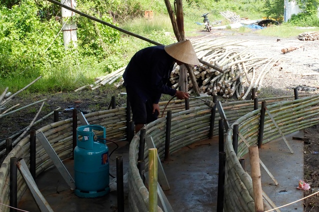 The preparation of the bamboo for construction, traditionally treated for two months in natural waterways followed by a further month’s treatment with smoke.