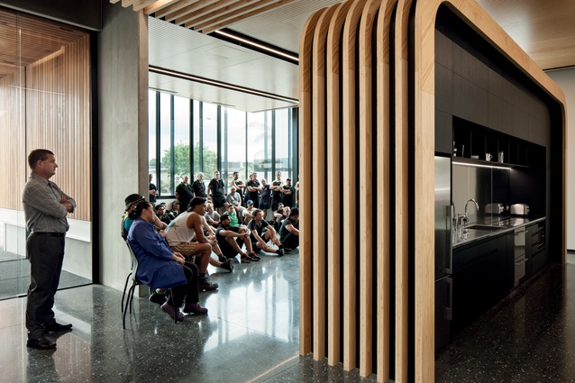 The events and cafeteria spaces are separated by an elegant plywood divider – the individual curved pieces are splice-cut and glued to straight pieces.