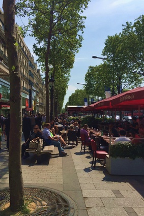 Designing public spaces, such as this one pictured in Paris, with greenery and public seating prompts people to linger, rather than rush past, and enjoy their city.