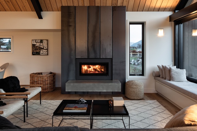 The blackened steel of the fire surround and oak floorboards lend a rustic feel to the house.