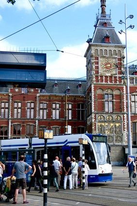 Tram at Centraal Station, Amsterdam: transport hubs are a vital part of an integrated public transport system, reducing citizens’ reliance on cars.