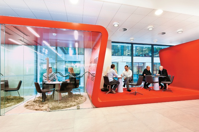 Westpac’s fitout introduces significant amounts of a signature colour — red —into the design elements.A “red ribbon” wraps over informal meeting spaces in the lobby. Employees can
come out for meetings so visitors don’t have to pass through the bank’s security turnstiles. 
