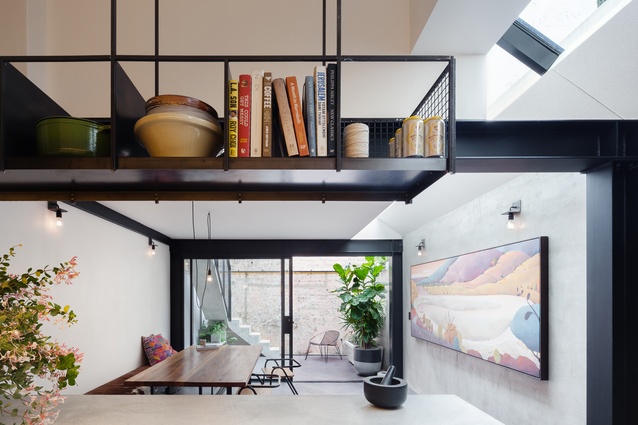 The living area remains bright and cheerful thanks to the large skylights above.