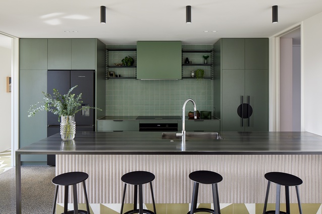 Hay ‘Revolver’ barstools line up at the kitchen island.