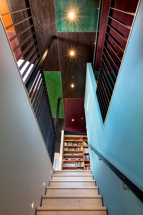 The ceiling features panels of stained plywood, inspired by the colourful plumage of the local tui in flight.