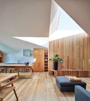Twin skylights meet to form an abstract infinity symbol, which represents the owners’ relationship.
