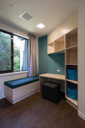 While each room, with an en suite, is judiciously designed to avoid self-harm, it welcomes visitors on the day-bed and fresh air through openable windows.