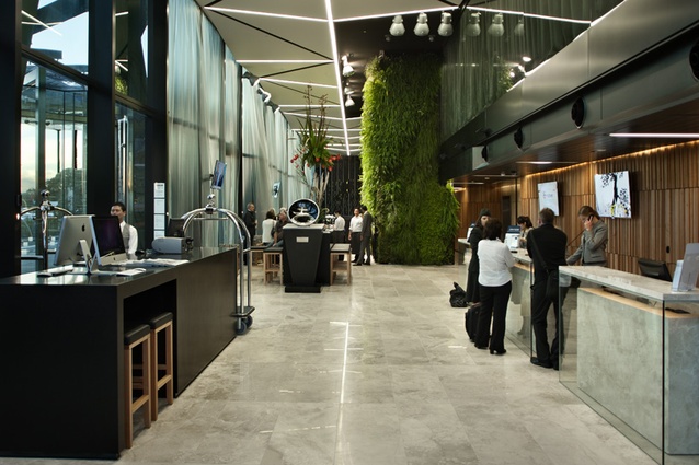Social spaces at ground level include check-in, restaurant and bar. The ‘living wall’ is an unmissable feature.
