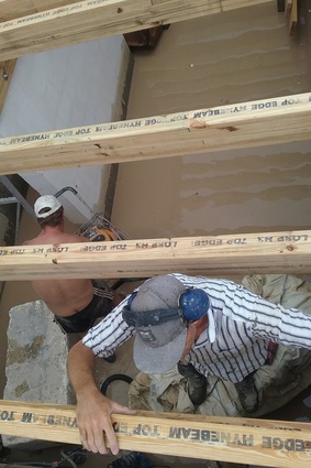 Joel and Max installing the basement HYNE Beam roof timbers.
