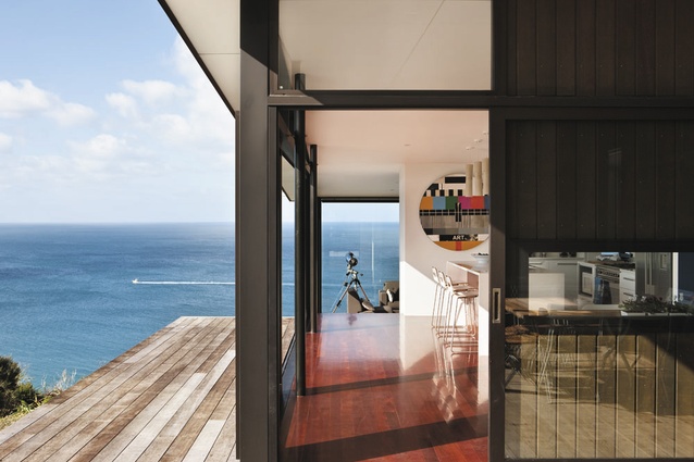 Kitchen and dining areas are surrounded by decks on two sides.