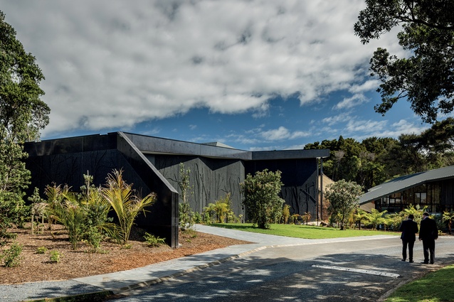 Visitors walk up the side of the building and through the gabled Gateway Building to receive the full and proper first impressions of the Te Kōngahu building, in a similar way to entering a marae via a waharoa.