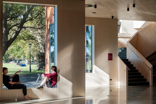 Grooved ply sarking lines the foyer walls and ceiling as well as the stairway, giving it a sculptural effect.