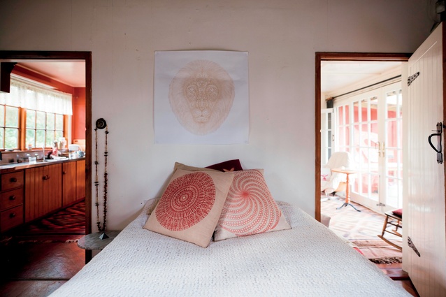A Peacekeeper on the wall, the Kumbalaya lion, and two mandala prints on the cushions.