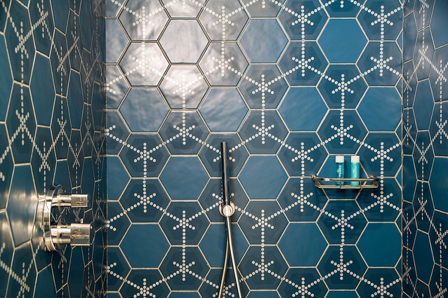 Tile-work offers an explosion of colour which seems elegant when contrasted to the otherwise pared-back tones of the room's interior. 