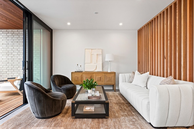 The interior living space of one of the Wharf Terraces. The open-plan living space on the top level opens up to a balcony and uninterrupted views.