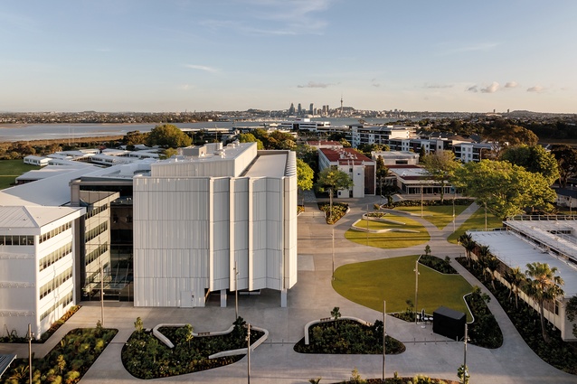 Full-height glazing separates the new wing from the existing AF building.