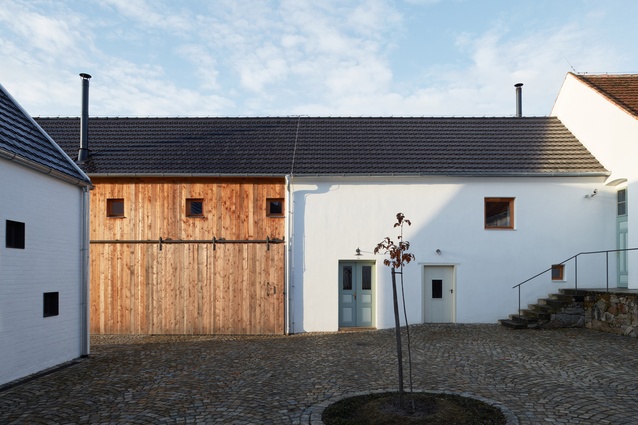 Javorník distillery in the Czech Republic by ADR studio. The newly built distillery blends easily with the renovated farm buildings that it shares a site with.