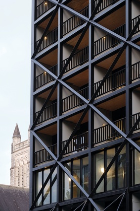 Most of the floors are mass timber panels braced laterally by the steel lattice that gives the building its distinctive frontage.