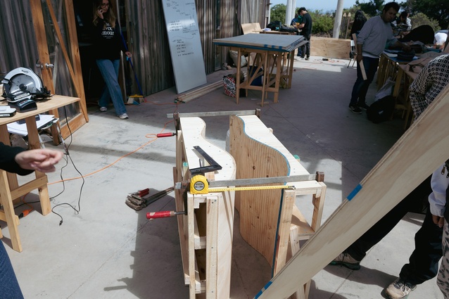Students in the taller de obras construct prototypes for rammed earth formwork.