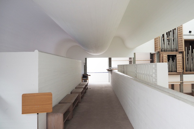 Upstairs, the waves of the concrete ceiling are experienced more closely.