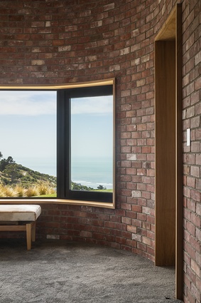 Recycled bricks line the bedroom and bathroom pods, offering a handcrafted aesthetic to the space.
