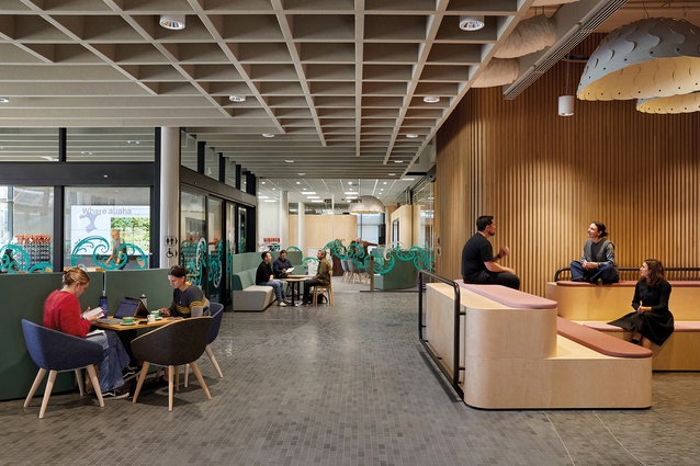 Informal and formal presentation spaces fringe the groundfloor café space. Oak from trees felled on campus lines the lift core.