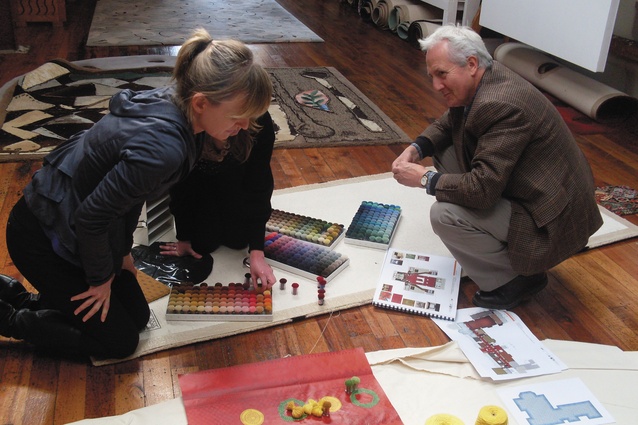 Sophie Vial from Athfield Architects and Gavin Chilcott discuss colours for the Axminster hall runners at Dilana Workshop.