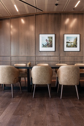 One of many meeting spaces within the hotel features warm timber panelling.