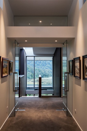 The entrance gallery establishes a sense of arrival, offering a vignette of the view.