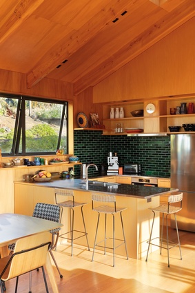 The generous kitchen and dining space has a relaxed, colourful aesthetic.