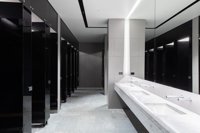 The end-of-trip changing facilities use a clean, monochromatic palette.
