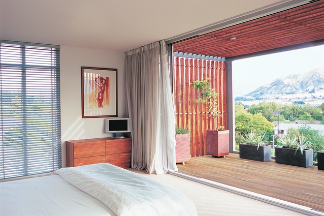 The master bedroom, like the lounge on level two, has a large, view-capturing deck.