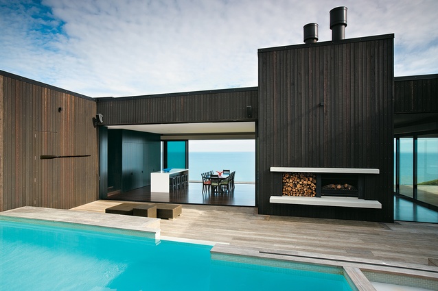 Blue on blue – looking from the pool and internal courtyard through the dining and kitchen areas to the sea. 