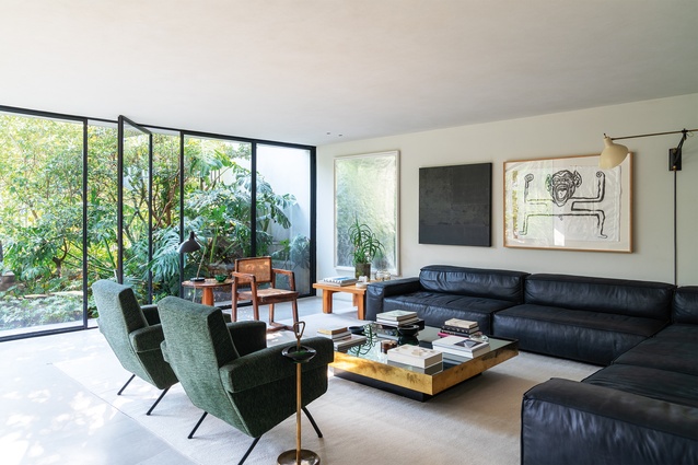 The effortlessly integrated arrangement of owner Moisés Micha's art into his Mexico City home feels curious, warm and incredibly alluring.