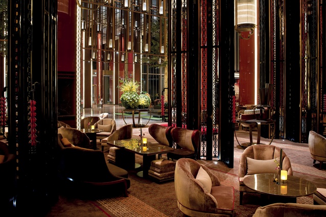 The main lobby follows Confucian proportions and uses a traditional palette of red lacquer and walnut. 